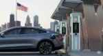Electric car charging at a station